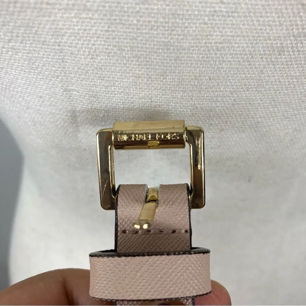Michael Kors slim pink leather belt with a gold-tone pin buckle.